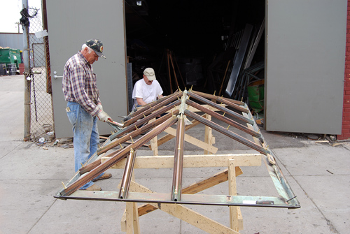 Polish worker(Stanislaus) and Ukranian associate  in Williamsburg,refurbishing a skylight