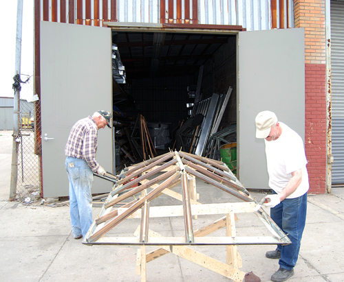 Polish worker(Stanislaus) and Ukranian associate in Williamsburg,refurbishing a skylight